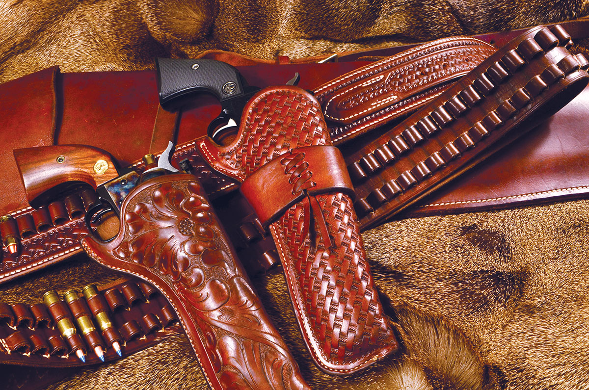 Two gorgeous holsters from the original George Lawrence of Portland. In addition to their plain but lovely oiled leather, Lawrence offered basket weave or floral tooling. These are, naturally, more expensive but worth every penny.